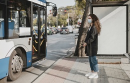 side view woman waiting bus